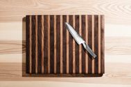 global chef knife on wooden cutting board
